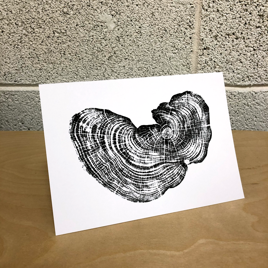 Card featuring a high quality ink jet print of an original relief print of a section of fallen cedar tree salvaged in Rollingwood, Texas.